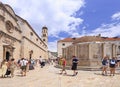 Tourists walking on ancient Stradun street in old city in Dubrovnik Royalty Free Stock Photo