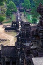 Tourists walking into the Angkor temple