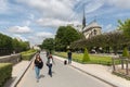 Tourists walking around the Notre Dame cathedral in Paris, France Royalty Free Stock Photo