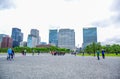 Tourists walking around the park in front of the Imperial Palace in Tokyo