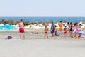 Tourists walking on the beach