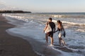 Tourists walking on the beach