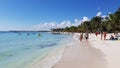 Tourists walking on the beach