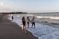 Tourists walking on the beach