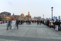 Tourists walking in the Bund, the most scenic spot in Shanghai. On background the most famous Chinese skyscrapers Royalty Free Stock Photo