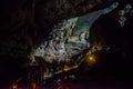 Tourists walking into deer cave at Gunung Mulu national park. Sarawak.