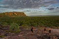 tourists walking down from the Nadab Lookout in ubirr, kakadu national park - australia, northern territory Royalty Free Stock Photo