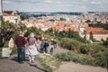 Tourists walking down a path overlooking rooftops of Prague`s Lesser Town, Prague Royalty Free Stock Photo