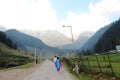 Tourists walking down the roads in Aru Valley, Pahalgam, Kashmir, India Royalty Free Stock Photo