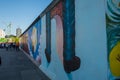 Tourists walking by the east side Gallery a part of the Berlin Wall Royalty Free Stock Photo