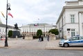 Tourists and a Polish police car in front of the Presidential Palace in Warsaw, Poland Royalty Free Stock Photo