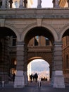 Tourists walking through the gate of the Federal Palace in Bern, Switzerland