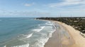 Tourists walking and hotels and guesthouses in front of the beach Royalty Free Stock Photo