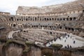 Tourists walking inside the Roman Colosseum in Rome, Italy Royalty Free Stock Photo