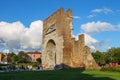 Tourists walking near the ancient arch of Augustus in Rimini, Italy Royalty Free Stock Photo