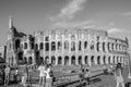 ROMA, ITALY - JULY 2017: Tourists are walking near the Arc de Triomphe of Constantine and the Colosseum in Rome, Italy Royalty Free Stock Photo