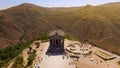 Tourists walking near old Garni temple, sightseeing in Armenia, aerial shot Royalty Free Stock Photo