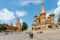 Tourists walking near Red square on a background of a St. Basil`s Cathedral Royalty Free Stock Photo