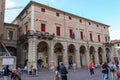 Tourists walking near Rimini City Hall on Cavour square