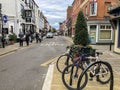 Tourists walking and bicycles on an Outdoor shopping street mall in Windsor and Eton , England, September 2020