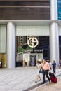 Tourists walking pass the Giorgio Armani store Royalty Free Stock Photo