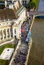 Tourists walking on the River Thames South Bank. London. Aerial view Royalty Free Stock Photo