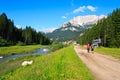 Tourists walking scenic path in Dolomites