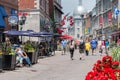 Tourists walking on St Paul Street and visiting Old Montreal in Summer Royalty Free Stock Photo