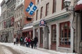 Tourists walking on St Paul Street and visiting Old Montreal in winter Royalty Free Stock Photo