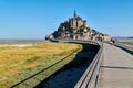 Tourists walking to Mont Saint Michel Normandy France