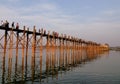 Tourists walking on the Ubein bridge in Mandalay, Myanmar