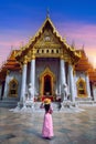 Tourists walking at Wat Benchamabophit or the Marble Temple in Bangkok, Thailand