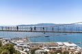 Tourists walking on Windsor suspension bridge Gibraltar
