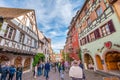 Tourists wander the streets of charming village of Eguisheim,France. Royalty Free Stock Photo