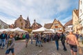 Tourists wander the streets of charming village of Eguisheim,France. Royalty Free Stock Photo