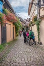 Tourists wander the streets of charming village of Eguisheim,France. Royalty Free Stock Photo