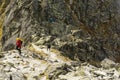 Tourists wandering one of the most difficult trails in the Tatras in Poland - Orla Perc Eagle`s Path. Royalty Free Stock Photo