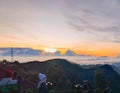 Tourists watch and document the sunrise from Penanjakan Hill, Bromo Tengger Semeru National Park, East Java, Indonesia.