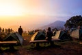 Tourists watch the sunrise Mountain.