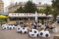 Tourists watching football game