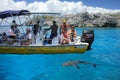 Tourists watching grey shark from a boat near Gece Island, Ouvea lagoon, Loyalty Islands, New Caledonia
