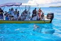 Tourists watching grey sharks from a boat near Gece Island, Ouvea lagoon, Loyalty Islands, New Caledonia