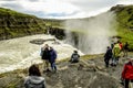 Tourists enjoying Gullfoss waterfall in South Iceland