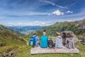 Tourists are watching Austrian Alps and cable cars in Zell am See-Kaprun region, Austria
