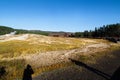 Tourists watching the Old Faithful erupting in Yellowstone National Park Royalty Free Stock Photo