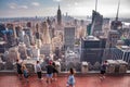 Tourists watching over the New York City from `Top of the Rock` observatory of Rockefeller Center