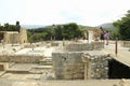 Tourists watching ruins of buildings in Knossos