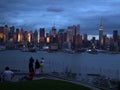 Tourists watching the silhouette of Lower Manhattan at night sky background Royalty Free Stock Photo