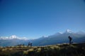 Tourists watching snowy mountains