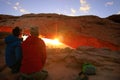 Tourists watching sunrise at Mesa Arch, Canyonlands National Par